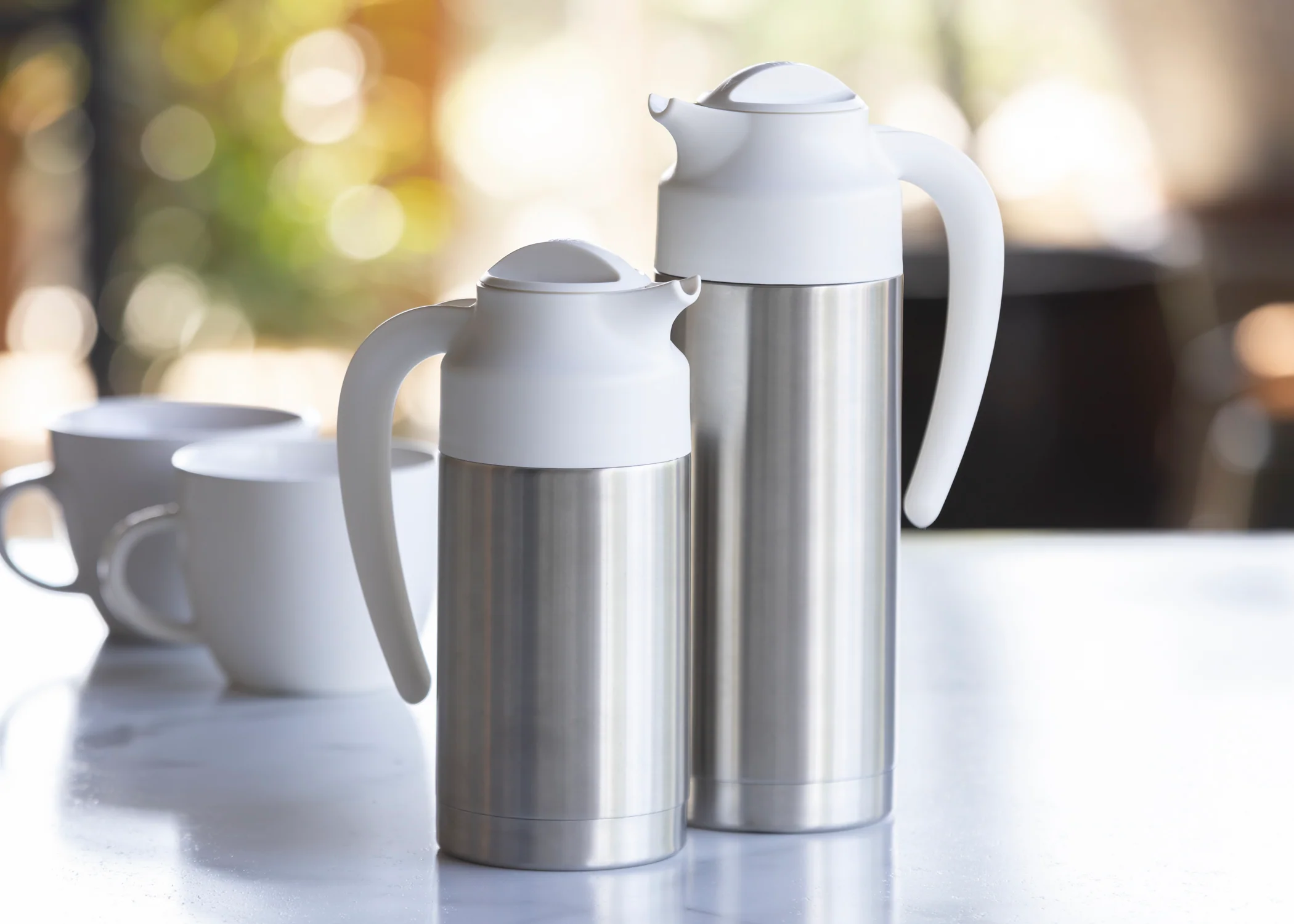 SteelVac® 0.7-Liter Vacuum Insulated Creamer with Steel Base in Brushed Stainless and White - Image 2